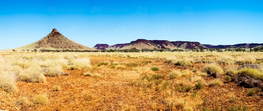 Panorama of hills and spinifex plains in the Pilbara - Australian Stock Image
