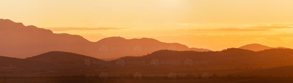 panorama of layered hills at sunset - Australian Stock Image