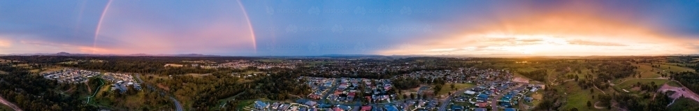 Panorama of rainbow and sunset 180 degrees - Australian Stock Image
