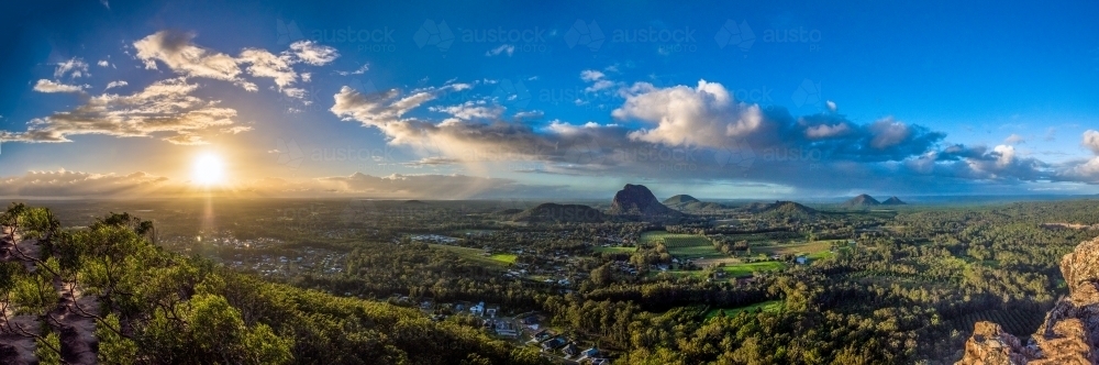 Panorama of sunrise over valley. - Australian Stock Image