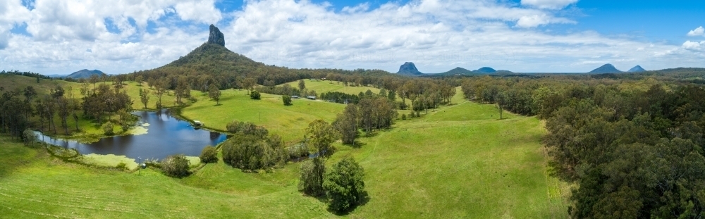 Panorama of Sunshine Coast rural vista with lake and Mount Coonowrin. - Australian Stock Image