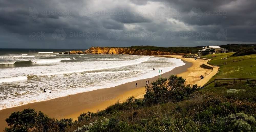 Panorama of surf beach with storm approaching - Australian Stock Image