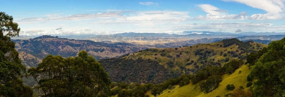 Panorama of view from highlands area looking across mountains - Australian Stock Image