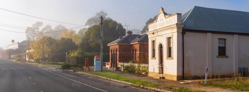 Panoramic streetscape with historic buildings on a foggy morning - Australian Stock Image