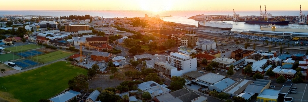 Panoramic view of the City of Fremantle and Fremantle Harbour as the sun sets on the horizon. - Australian Stock Image