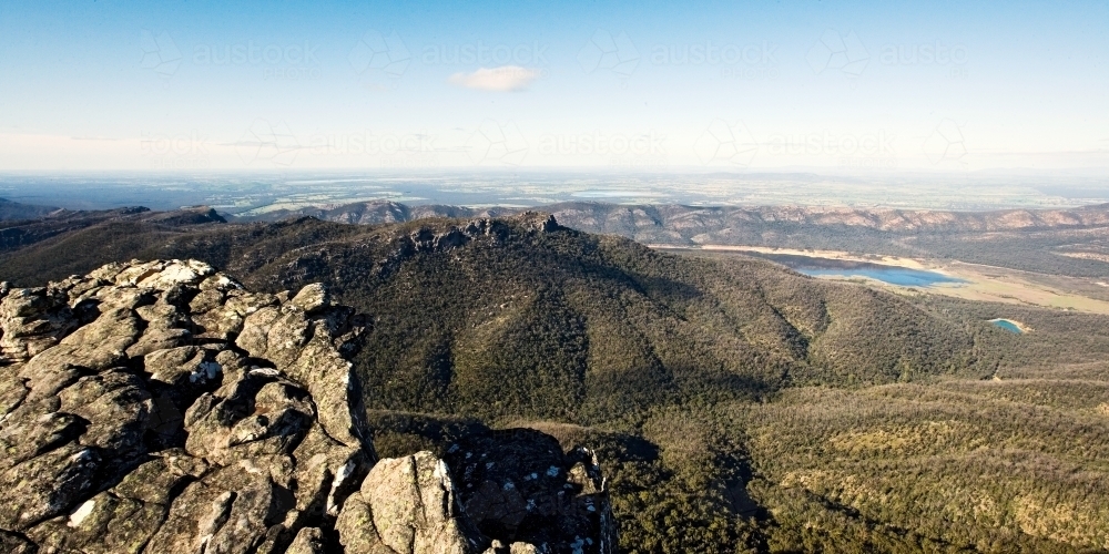 Panoramic view over mountain range and lake - Australian Stock Image
