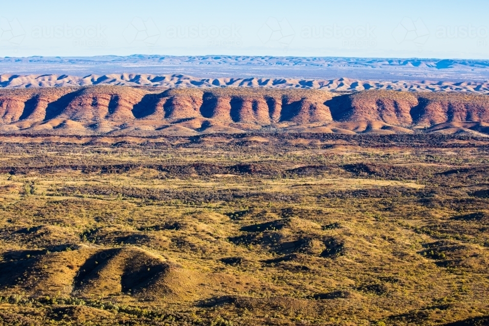 Parallel ridges and terrain of the West MacDonnell Ranges. - Australian Stock Image