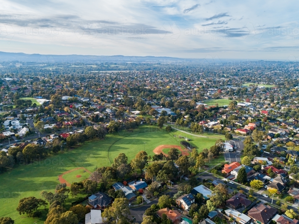 Park in city suburb of Vermont South surrounded by houses and buildings - Australian Stock Image