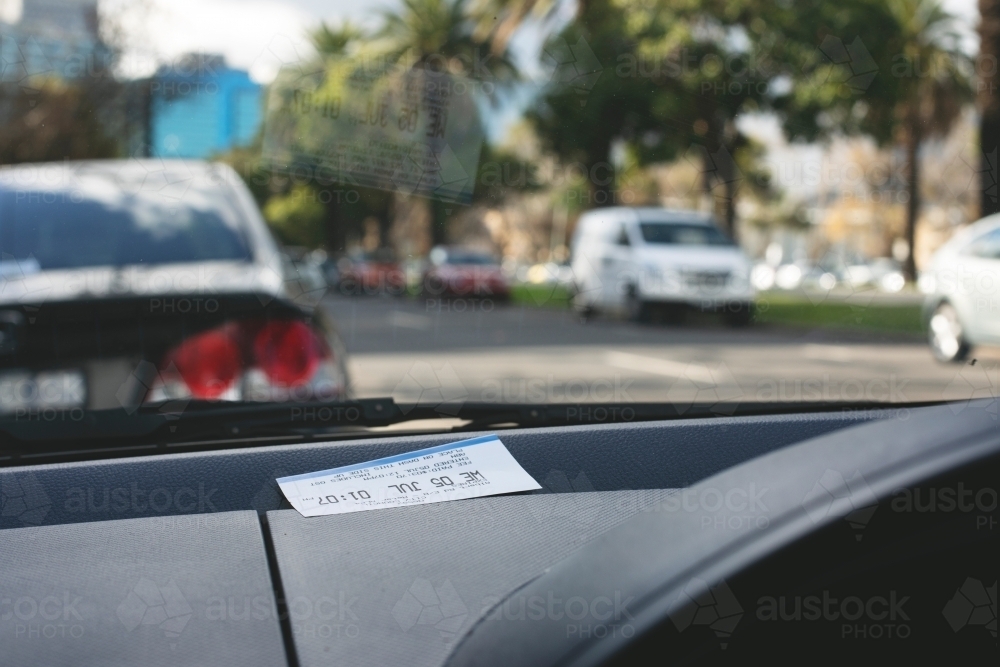 Parking ticket placed on car dashboard in Melbourne inner city - Australian Stock Image