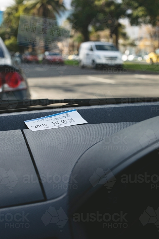 Parking ticket placed on car dashboard in Melbourne inner city - Australian Stock Image