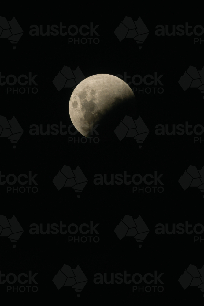 Image of Partial lunar eclipse showing the moon being obscured by Earth ...