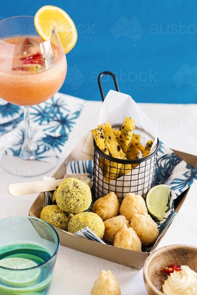 Party food and cocktail on table - Australian Stock Image