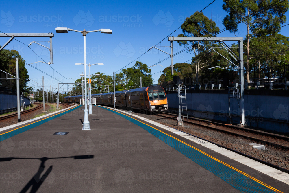 Image of Passenger train passing platform of Narwee station in Sydney ...