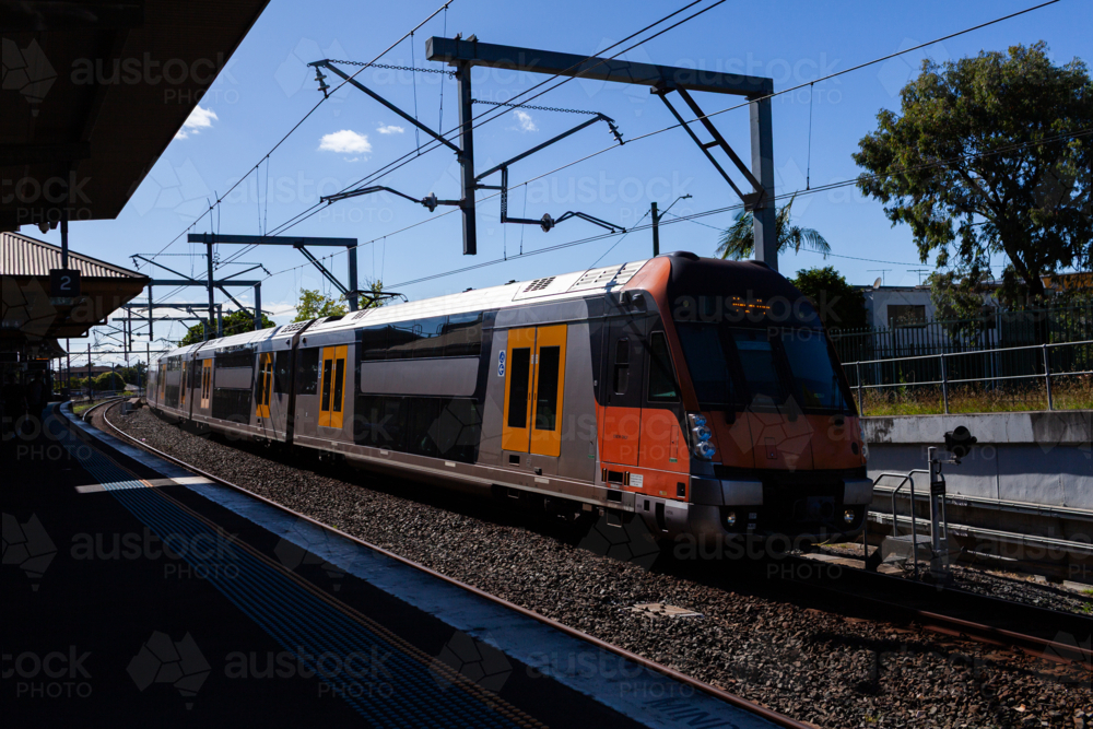 Image of passenger train passing platform of Narwee station in Sydney ...