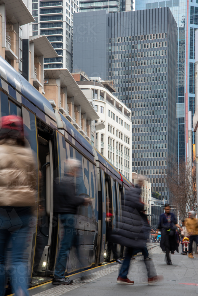 Passengers alighting tram in the city - Australian Stock Image