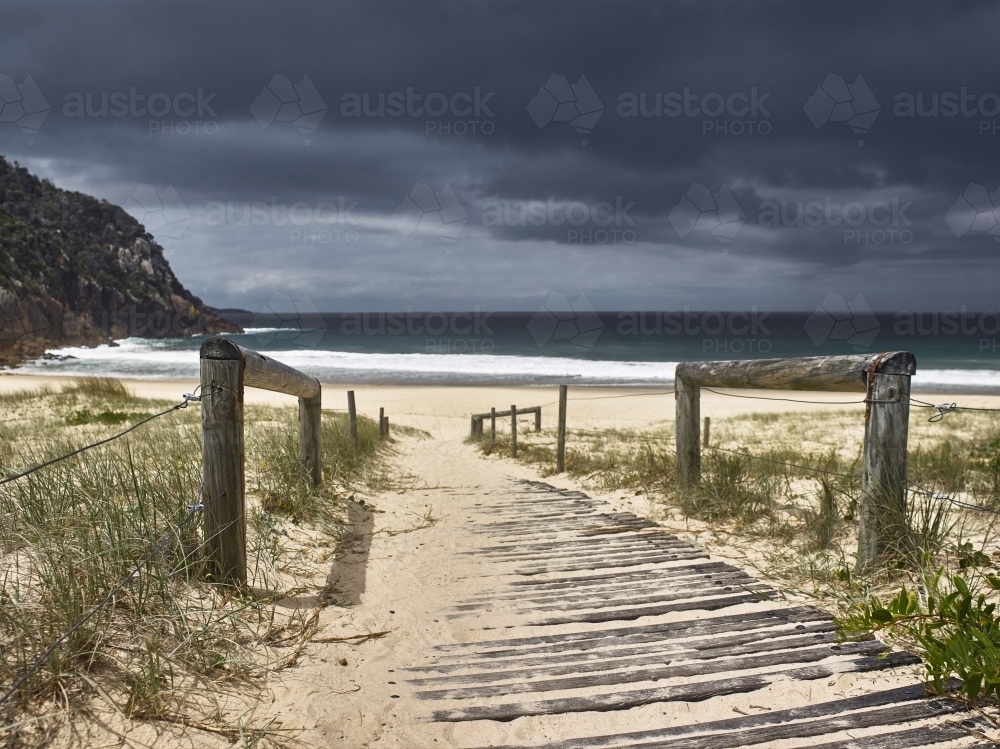 Path to beach with an approaching storm - Australian Stock Image