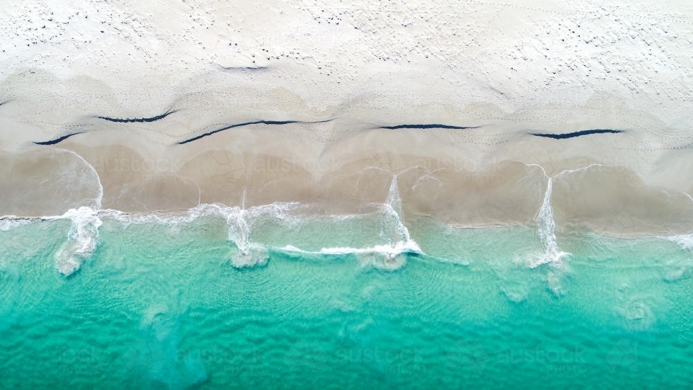 Patterns emerging as water returns to the ocean - Australian Stock Image