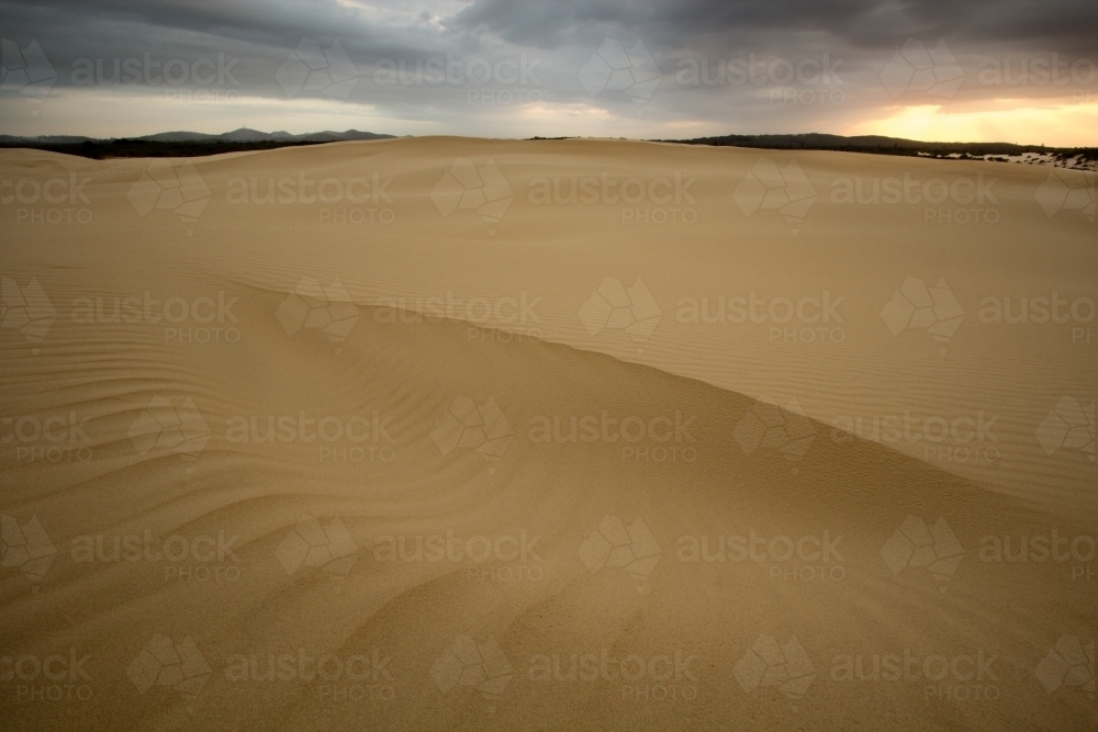 Patterns in sand dunes at sunrise - Australian Stock Image