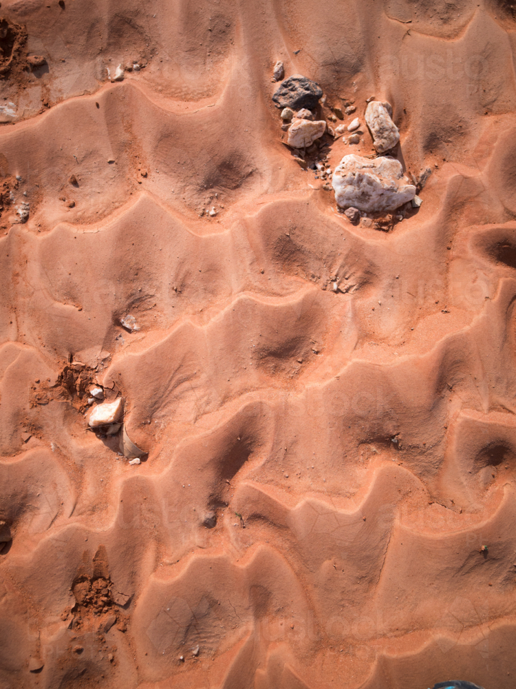 Patterns in the red dirt in outback Australia - Australian Stock Image