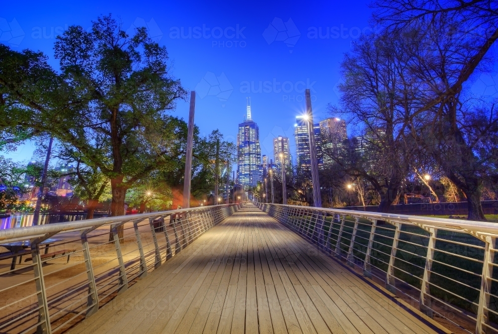 Pedestrian bridge in Birrarung Marr looking towards the city at night - Australian Stock Image