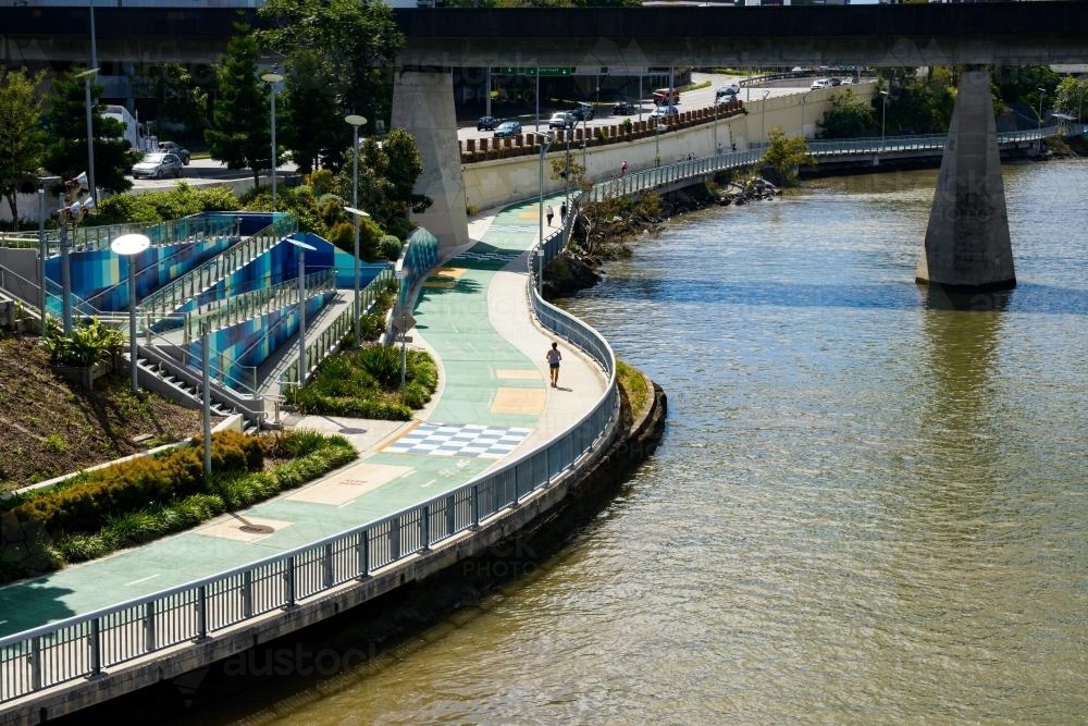 Pedestrians on the shared pathway beside the Brisbane River - Australian Stock Image