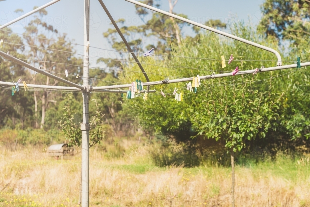 pegs on hills hoist clothesline - Australian Stock Image