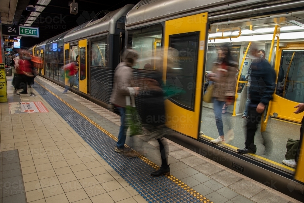 People alighting a train in the underground network in Sydney - Australian Stock Image