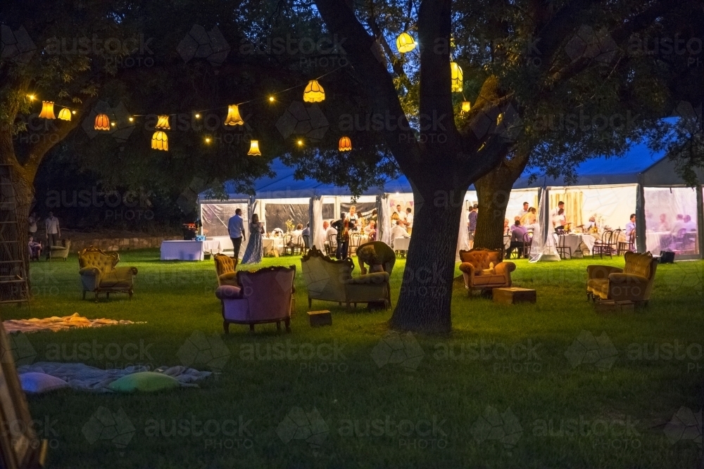 People at a party in marquee at night - Australian Stock Image