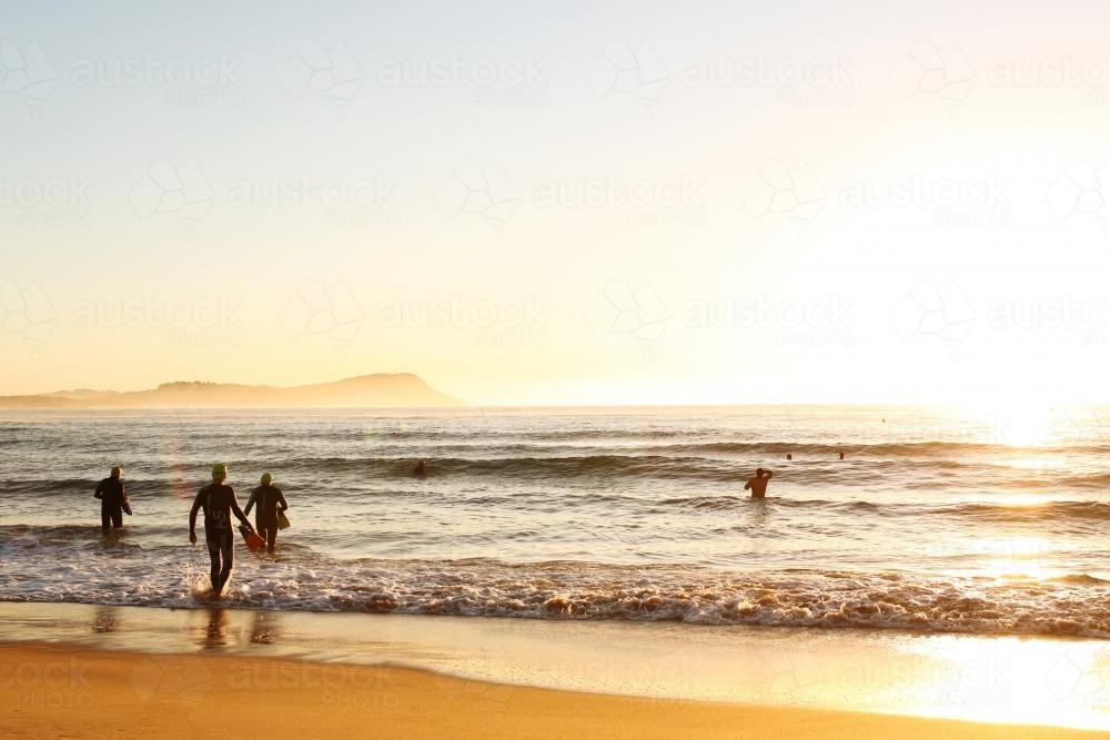 People going for a swim in the ocean - Australian Stock Image