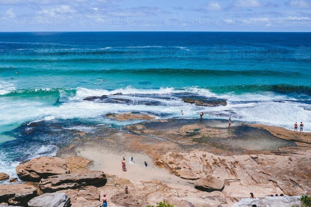 People in the rockpools between Tamarama and Bondi - Australian Stock Image