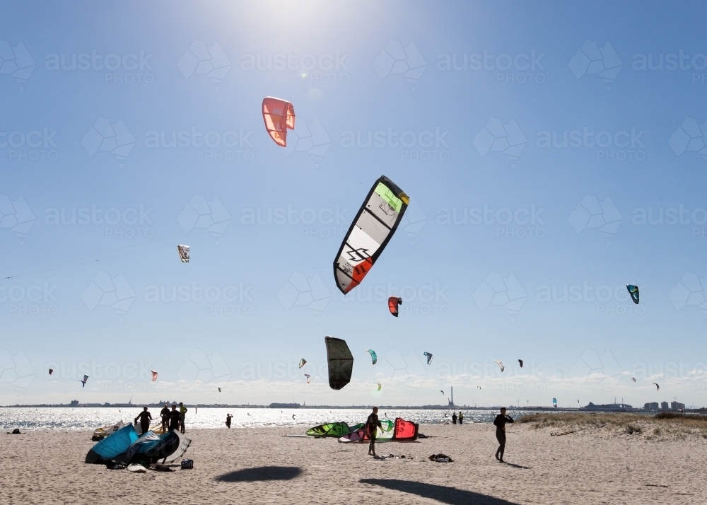 People kitesurfing at a city beach - Australian Stock Image