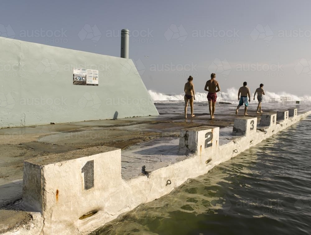 People looking out to sea at Newcastle Ocean Baths 05 - Australian Stock Image