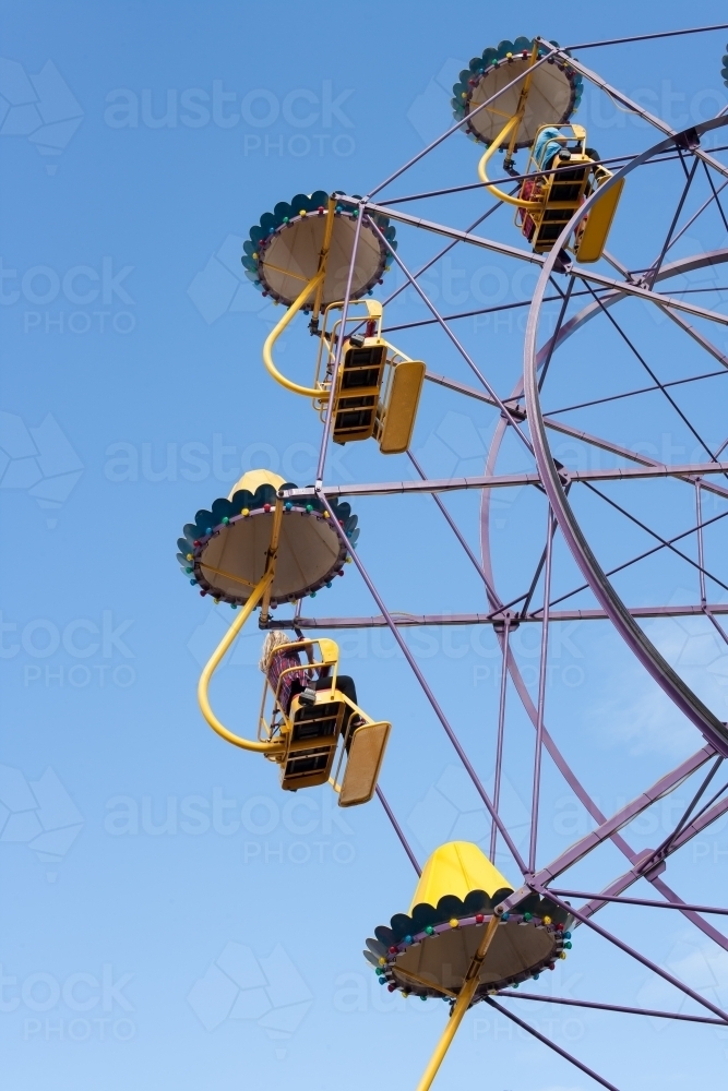 People on a ferris wheel at a city fun park - Australian Stock Image