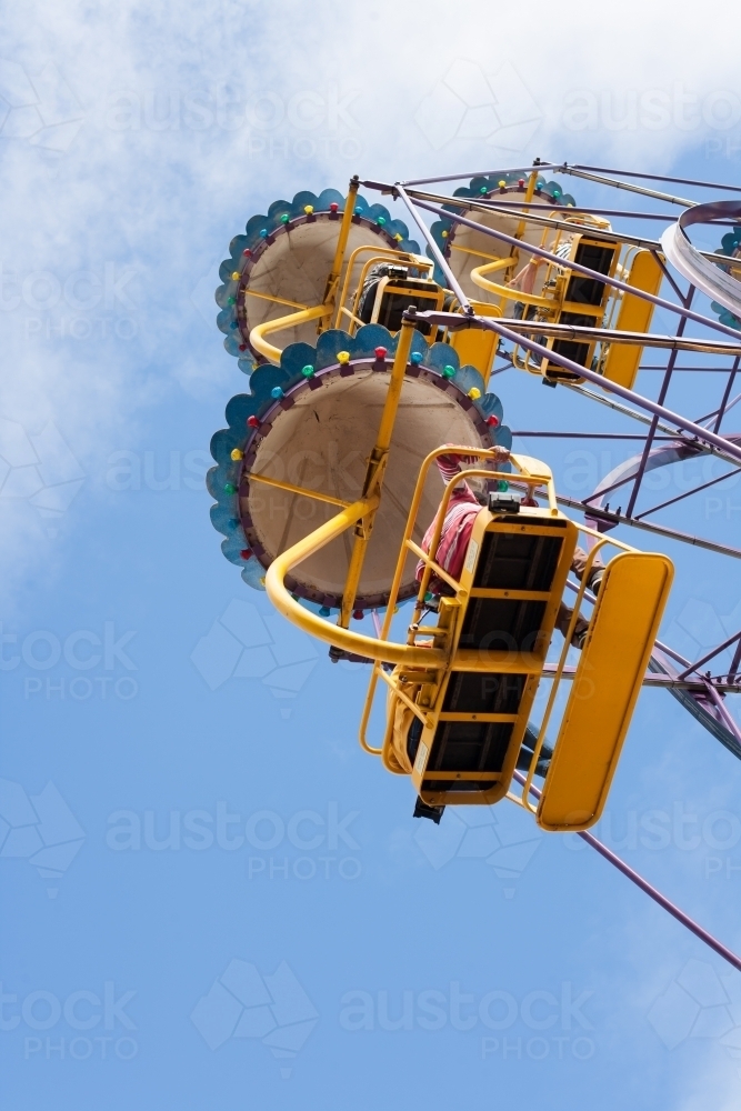 People on a ferris wheel at a city fun park - Australian Stock Image