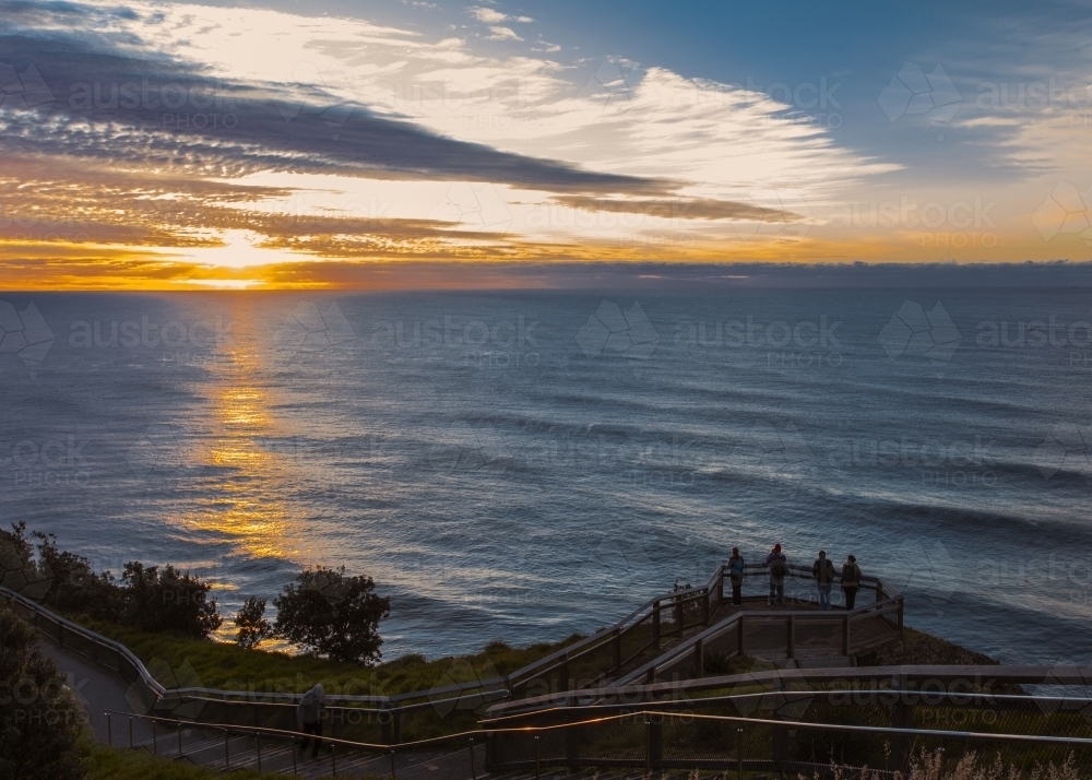 People on coastal lookout looking at the sunset - Australian Stock Image