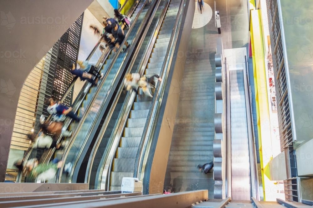People on escalators in a shopping centre - Australian Stock Image