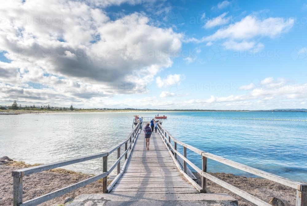 People on jetty by the sea - Australian Stock Image