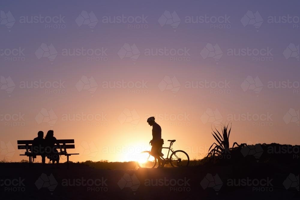 People silhoettes at sunset - Australian Stock Image