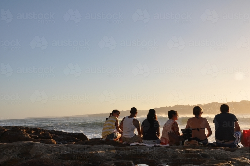People sitting on rocks - Australian Stock Image