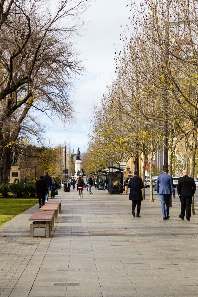 People walking along city street - vertical - Australian Stock Image