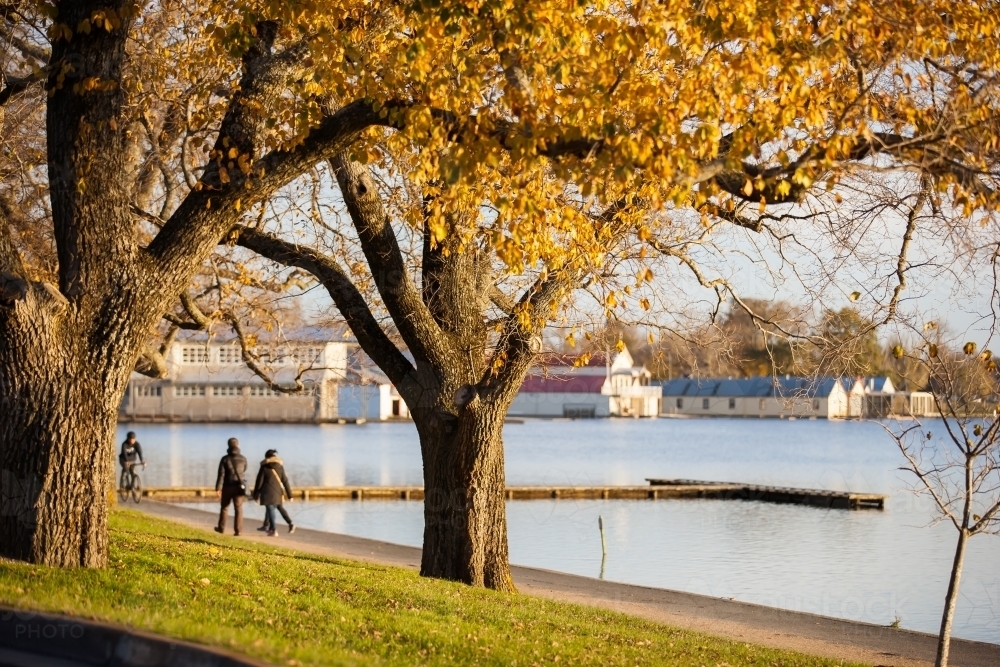 People walking near a lake - Australian Stock Image