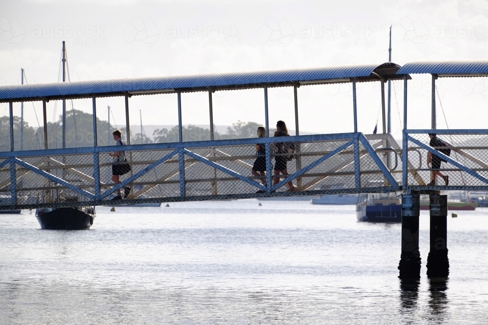 People walking on jetty at Karragarra Island - Australian Stock Image