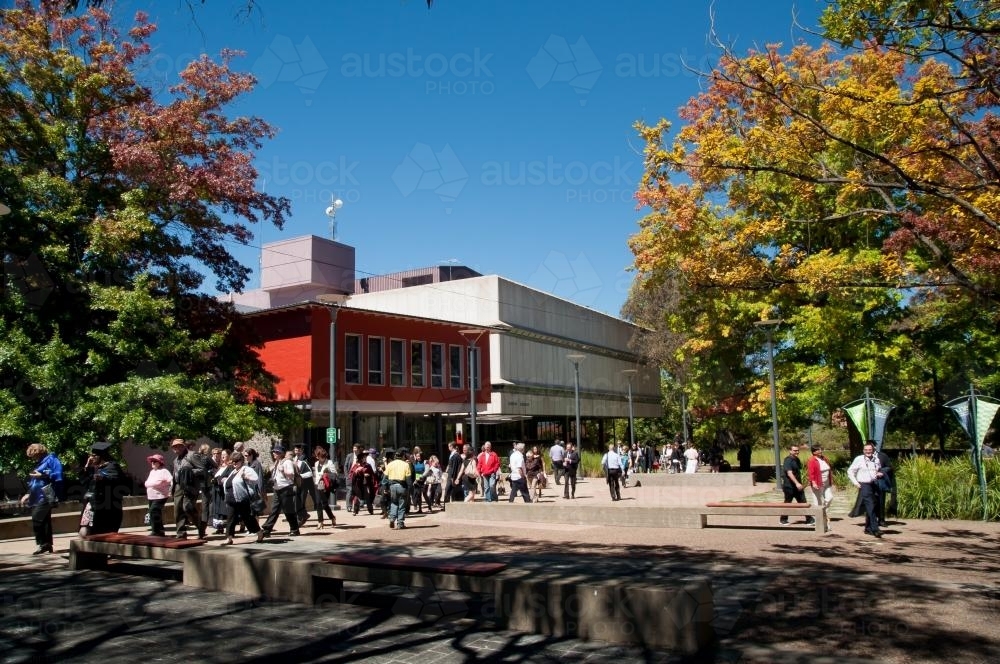 People walking past the University of New England Dixson Library - Australian Stock Image