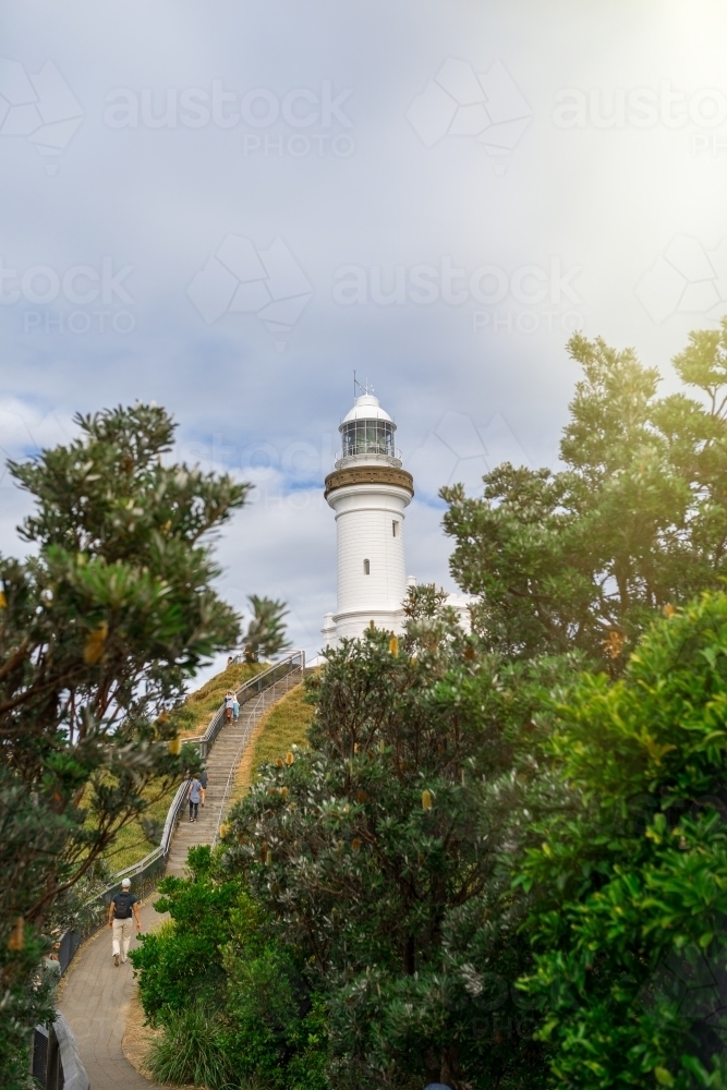 People walking up to the Byron Bay lighthouse - Australian Stock Image