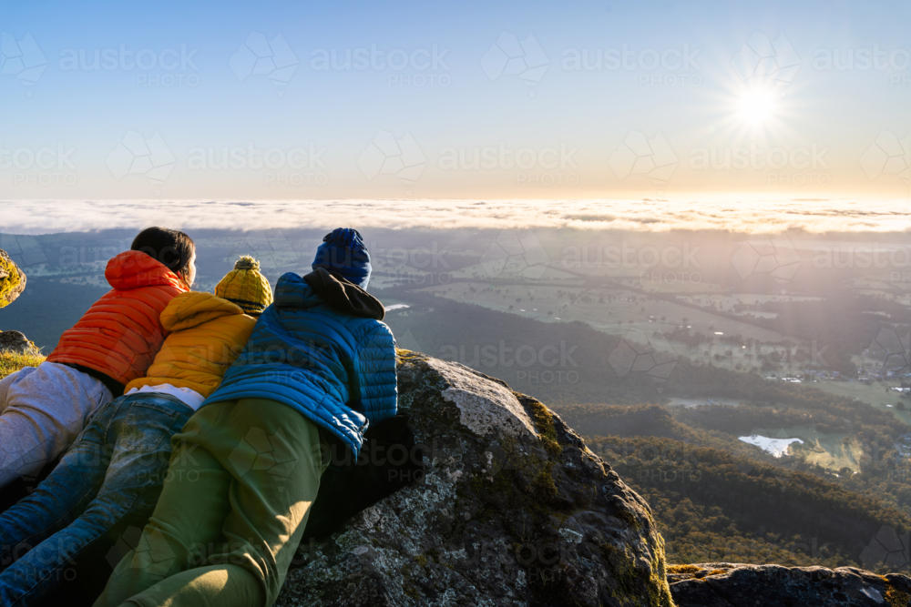 People watching the sunrise panorama from Boroka Lookout cliff at Grampians, Victoria, Australia - Australian Stock Image