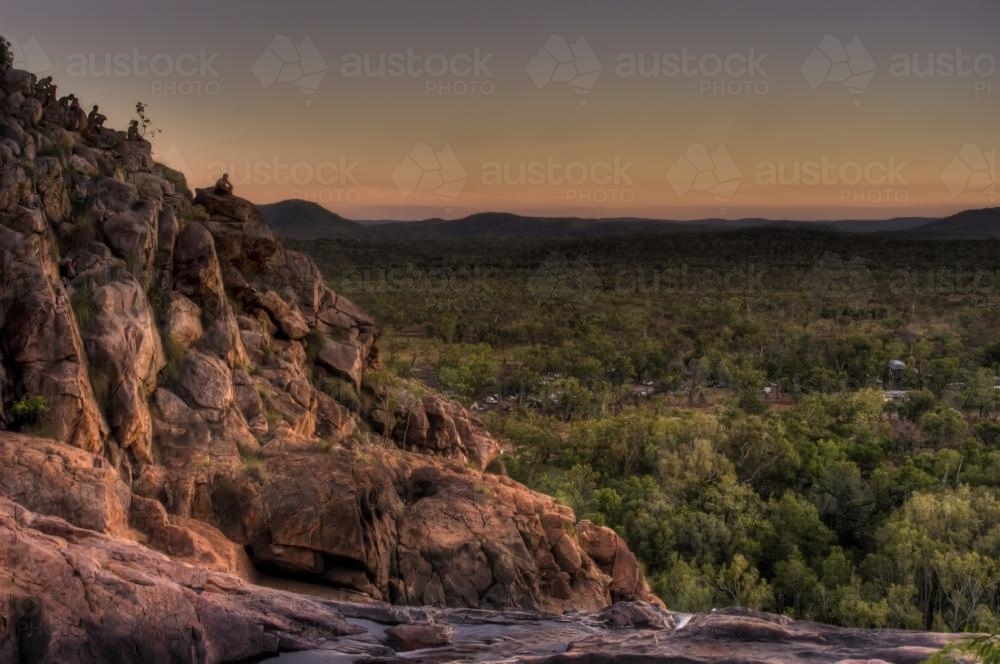 People watching the sunset over Gunlom Falls Kakadu - Australian Stock Image