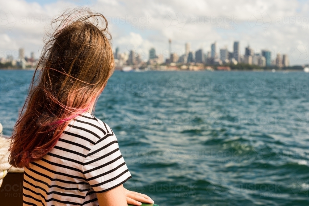 person on ferry looking at Sydney city - Australian Stock Image