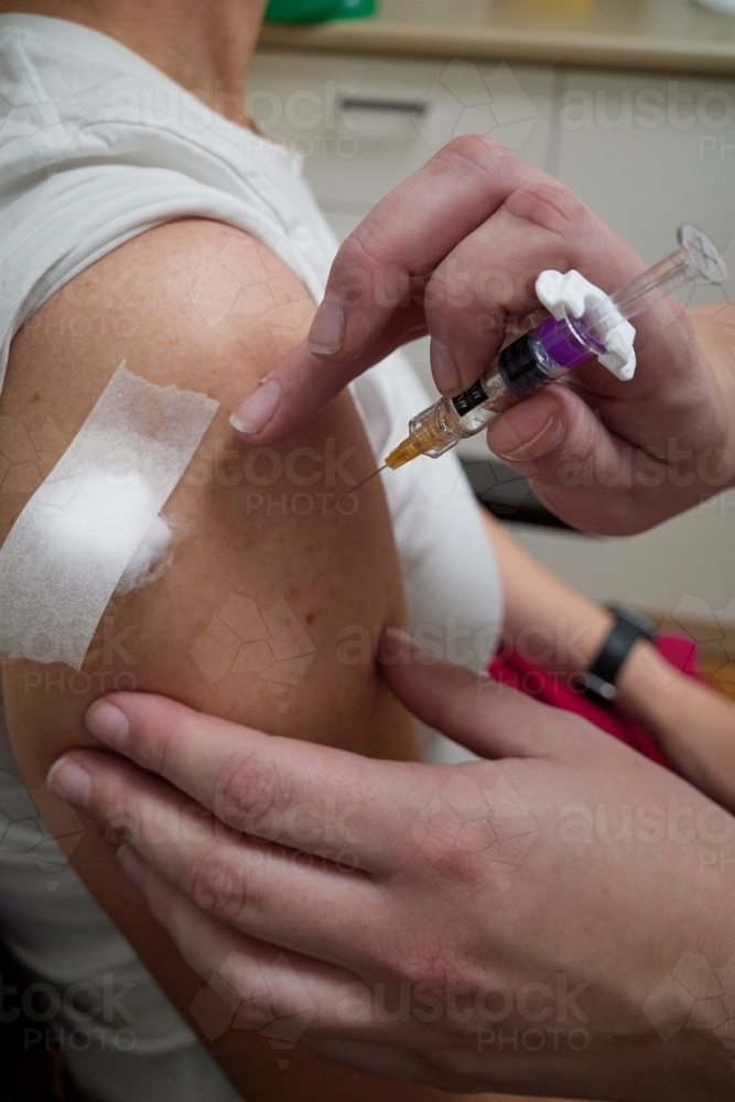 Person receiving Covid-19 vaccination - Australian Stock Image