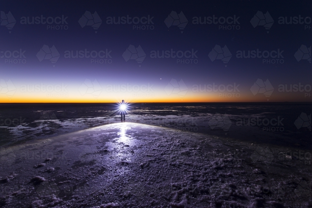 Person with a torch at night - Australian Stock Image