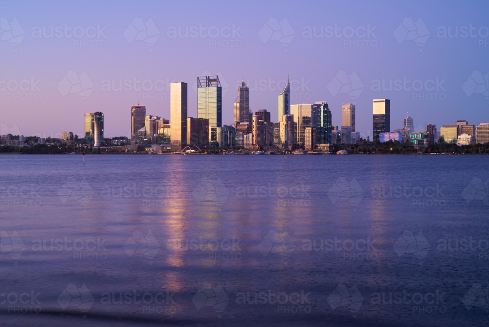 Perth City skyline at dusk across the Swan River - Australian Stock Image
